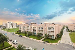 a large building with a street in front of it at Shubharohi stay in Chhatikara