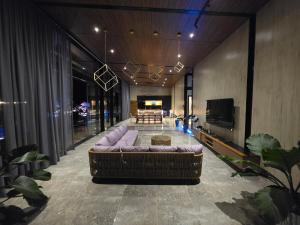 a large living room with a couch and a table at Dream View Villa Samal in Samal