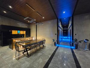 a dining room with a table and chairs at Dream View Villa Samal in Samal