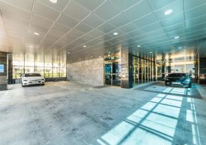a large building with two cars parked in it at Gimpo Pentastar Hotel in Gimpo
