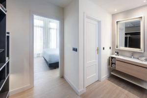 a bathroom with a sink and a mirror at INNSiDE by Meliá Madrid Gran Vía in Madrid
