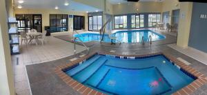 a large swimming pool in a hotel room at Days Inn by Wyndham Fargo - West Acres in Fargo
