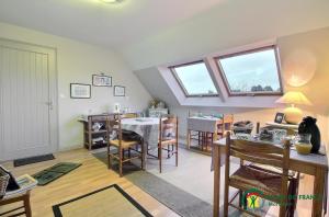 a living room with a table and a dining room at Chambres d'hôtes de botconan in Baden +19 photos