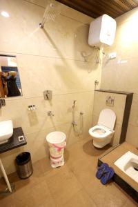 a bathroom with a toilet and a sink at Hotel ELITE CHOICE in Ajmer +47 photos