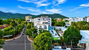 an empty street in a city with buildings at Q Song Chi Côn Đảo Hotel in Con Dao