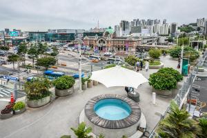 a view of a city with a pool and an umbrella at 서울역 2분거리, 클레어맨션 201 in Samgong