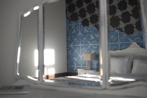 Uma cama ou camas num quarto em Casa com Historia