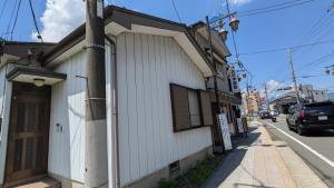a white building on the side of a street at GateFuji Fujisan Station in Fujiyoshida