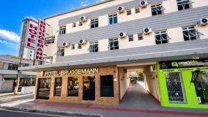 a building on a city street with a store at Hotel Bruggemann in Florianópolis