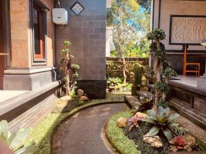 a garden in front of a house at Dika Homestay in Sidemen