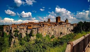 a town on top of a hill next to a bridge at Sospesi nel borgo in Vitorchiano