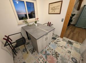 a room with a table and chairs and a window at Ferienwohnung Feenblick in Kurort Altenberg