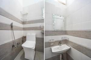 a bathroom with a toilet and a sink at Townhouse Manipal University Highway King Bagru Formerly Golden Hotel in Jaipur