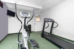a gym with an exercise bike in a room at Microtel Inn & Suites by Wyndham London in London