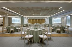 a banquet hall with tables and chairs in a room at Hyatt Regency Hesperia Madrid in Madrid