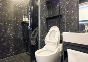 a bathroom with a toilet and a shower and a sink at Kinstay Hotel in Goyang +22 photos