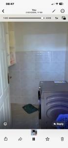 a bathroom with a shower with a toilet in it at Kiminini bnb in Kitale