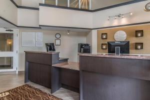 a view of the lobby of a hotel with a reception counter at Comfort Inn in Huntsville