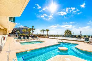 a pool at a resort with a view of the ocean at Ashworth 303 in North Myrtle Beach
