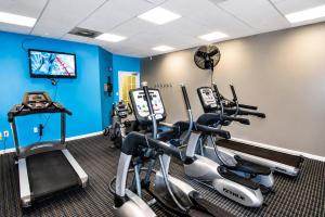 a gym with cardio machines and a flat screen tv at Ashworth 303 in North Myrtle Beach