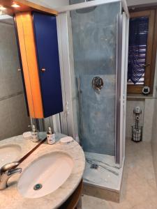 a bathroom with a sink and a shower at B&B La Casa di Gastone in Mercogliano +37 photos