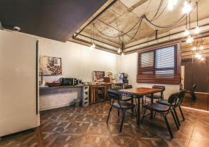 a kitchen with a table and chairs in a room at Chuncheon Urbane Hotel in Chuncheon +21 photos