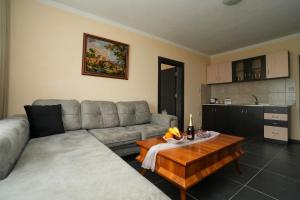 a living room with a couch and a table at Hotel Santa Ria in Kŭrdzhali