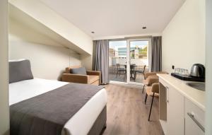 a hotel room with a bed and a kitchen and a sink at Taksim Galataport FRZ Burak Hotel in Istanbul +52 photos