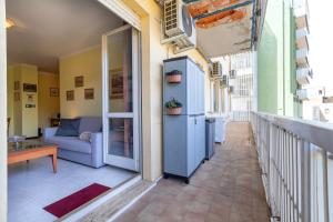 a balcony with a couch and a table at Cuncordu Affittacamere- Sassari in Sassari