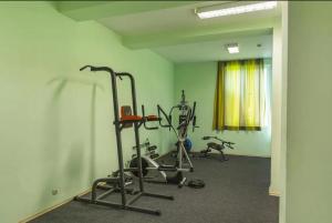 a gym with two exercise bikes in a room at Dalis Sunny Beach in Sunny Beach