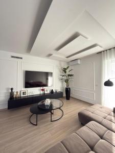 a living room with a couch and a coffee table at Villa Ikal in Modugno