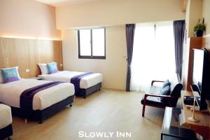 Katil atau katil-katil dalam bilik di Slowly inn