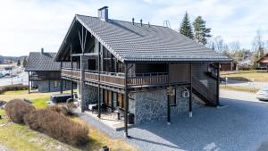 a rendering of a house with a roof at Himos Mökki superior - Chalet Cottage superior ski-in-ski-out in Jämsä