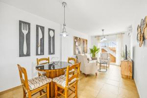 a living room with a dining room table and chairs at Costa Africana in Vejer de la Frontera