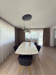 a dining room with a table and chairs at Villa Ikal in Modugno