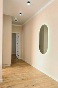 an empty room with a mirror on the wall at Жк "AUEZOV" in Kokshetau