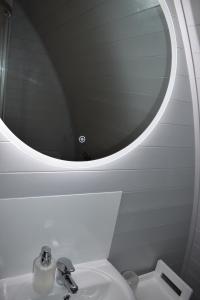 a bathroom with a sink and a mirror over a toilet at Leahys Pod Park in Cork +25 photos