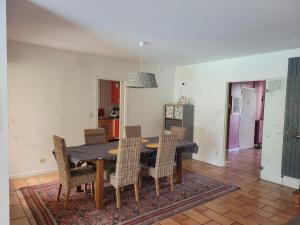 a dining room with a table and chairs at Peaceful Vosges heaven in Granges-Aumontzey