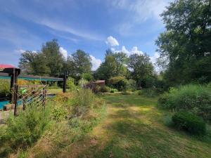 a garden with a swimming pool and a gazebo at Peaceful Vosges heaven in Granges-Aumontzey