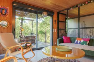 a living room with a table and a couch at Casa Frida in Salavas