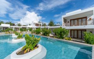 an image of a villa with a swimming pool at Legendary Zanzibar Beach Resort in Michamvi