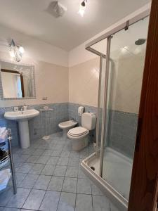 a bathroom with a toilet and a sink and a shower at BnB Villa Melany vicino Centro in Lucca +72 photos