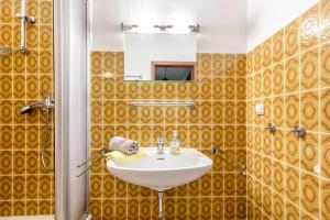 a bathroom with a sink and a mirror at Haus Passat in Büsum +161 photos