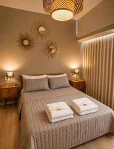 a bedroom with a large bed with two mirrors on the wall at Armonium Airport in Ezeiza +48 photos