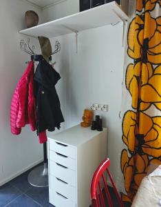 a room with a desk and a cabinet and a chair at Päivärannantila in Pihtipudas +44 photos