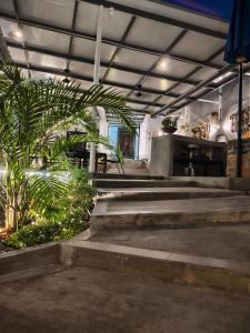 a group of stairs in a building with plants at 19 Farmstay in Bukit Mertajam
