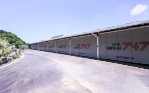 a long row of buildings on the side of a road at 747 Motel in Gimcheon