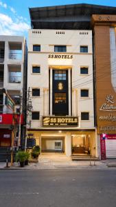 a store front of a building with a hotel sign at Open Hotel by Olive - G SILVER SS hotel in Tiruppūr