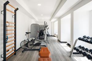 a gym with bikes and exercise equipment in a room at Sercotel Hotel Parque in Las Palmas de Gran Canaria