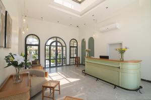 a lobby with a reception desk in a building at Santino Boutique Hotel in El Alamein